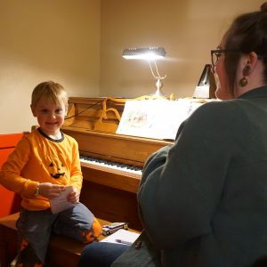 Piano lesson with young student